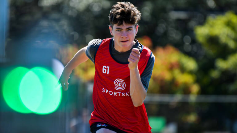 Sporskey male athlete sprinting at testing event